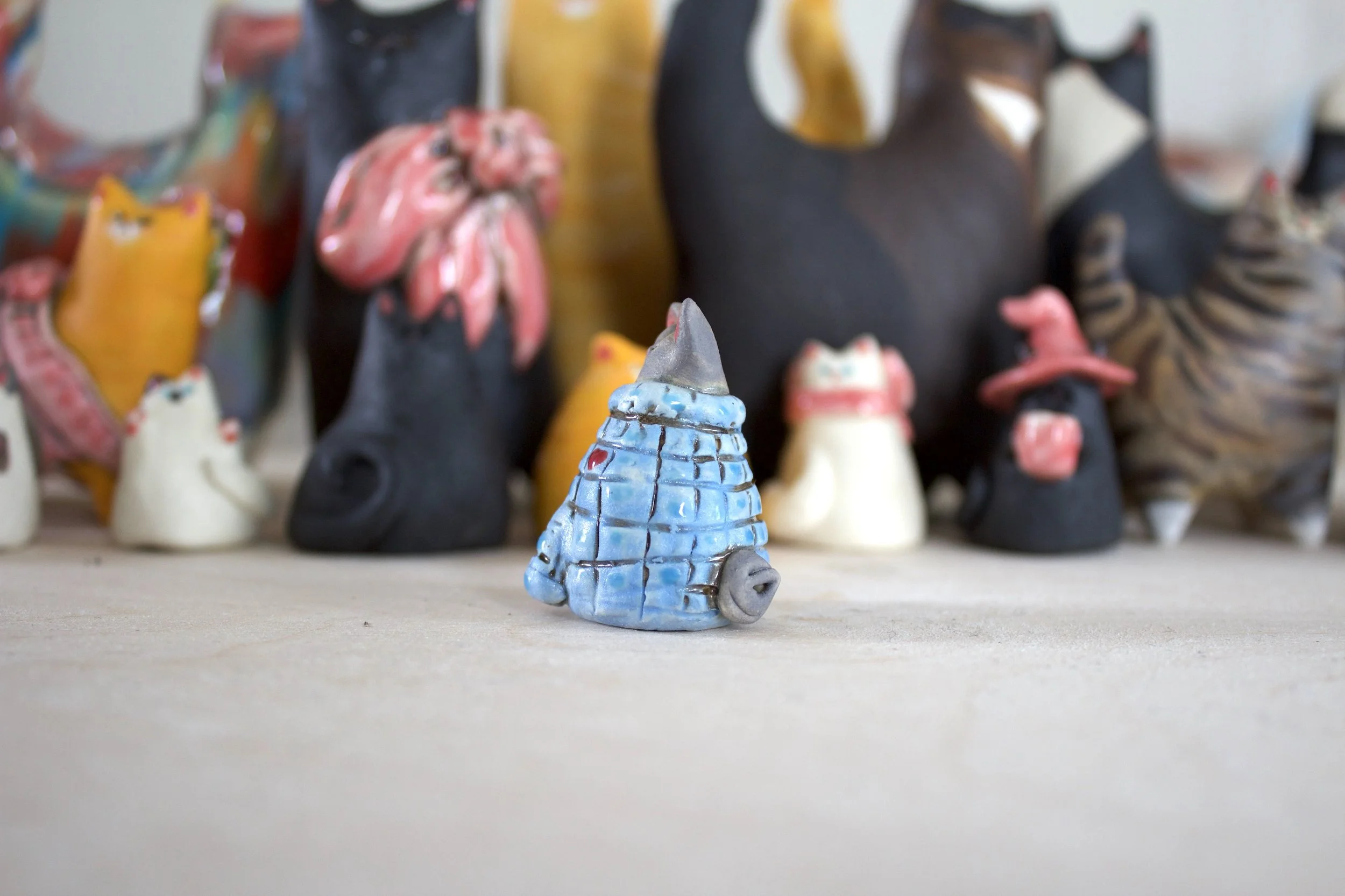 Side view Sphynx ceramic cat chime handmade sculpture.jpeg