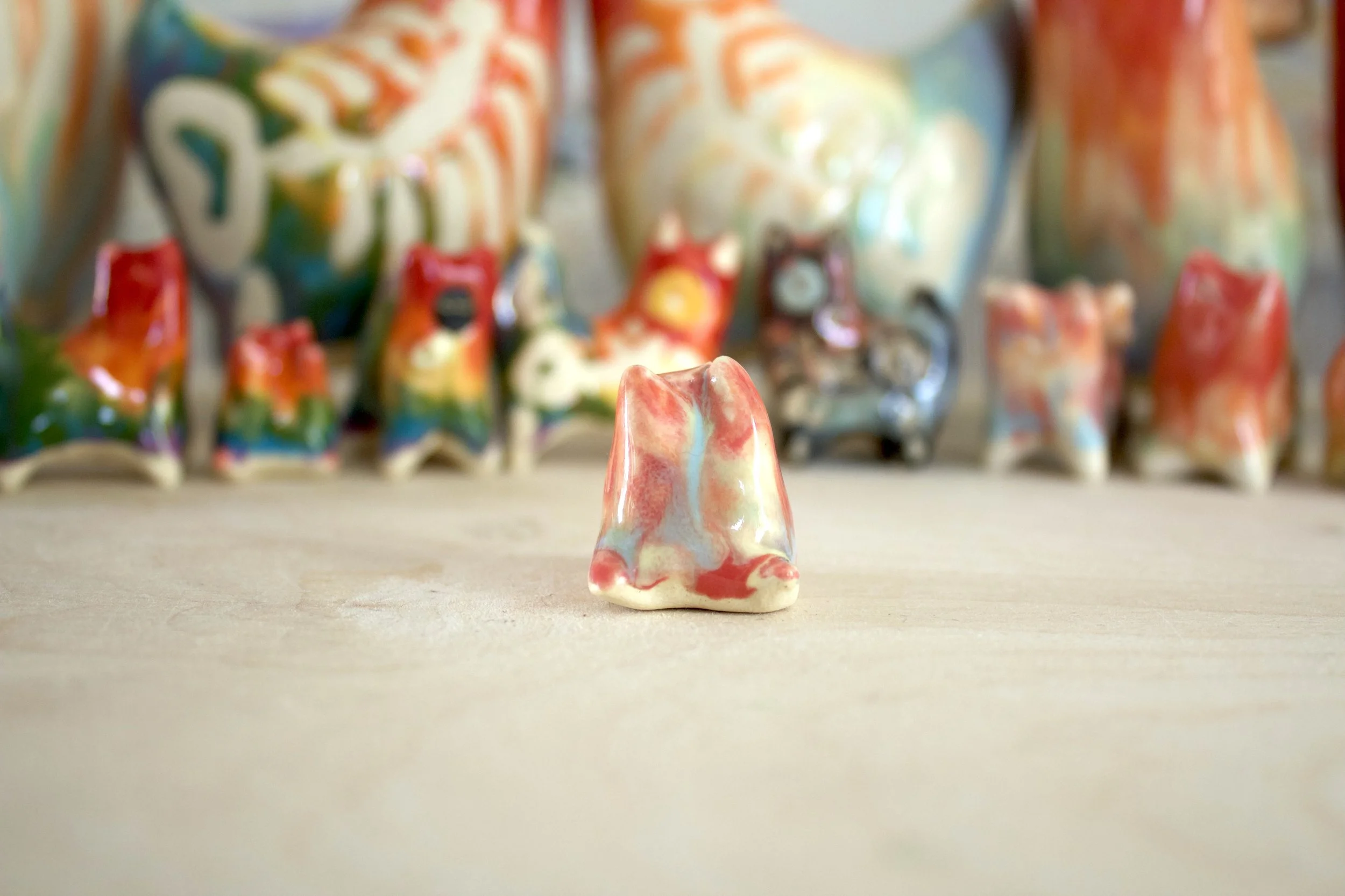 One-of-a-kind handmade ceramic Pastel Rainbow Cat No. 1 viewed from the front.jpeg