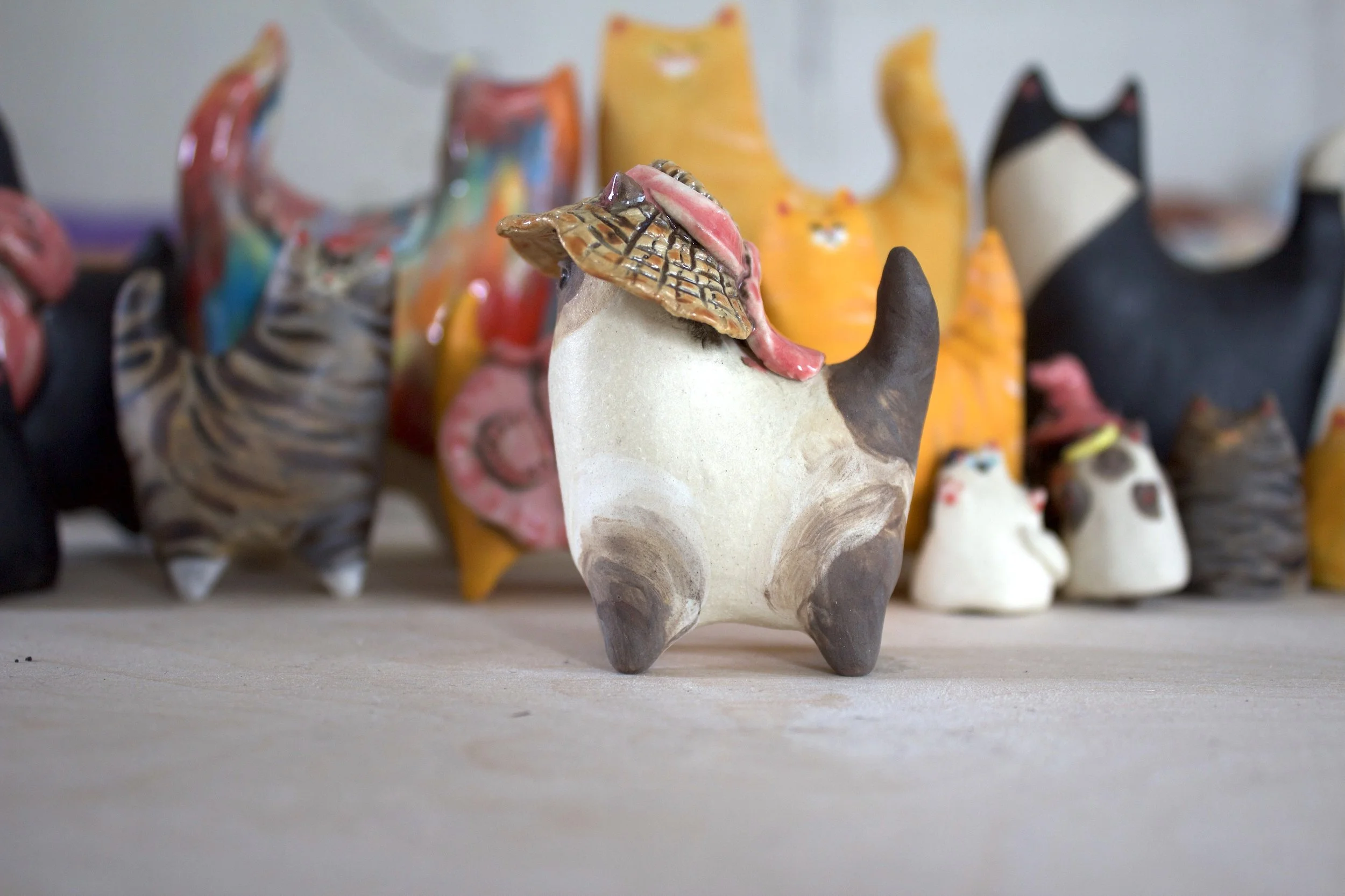 Side view Chocolate Point Siamese ceramic cat sculpture.jpeg