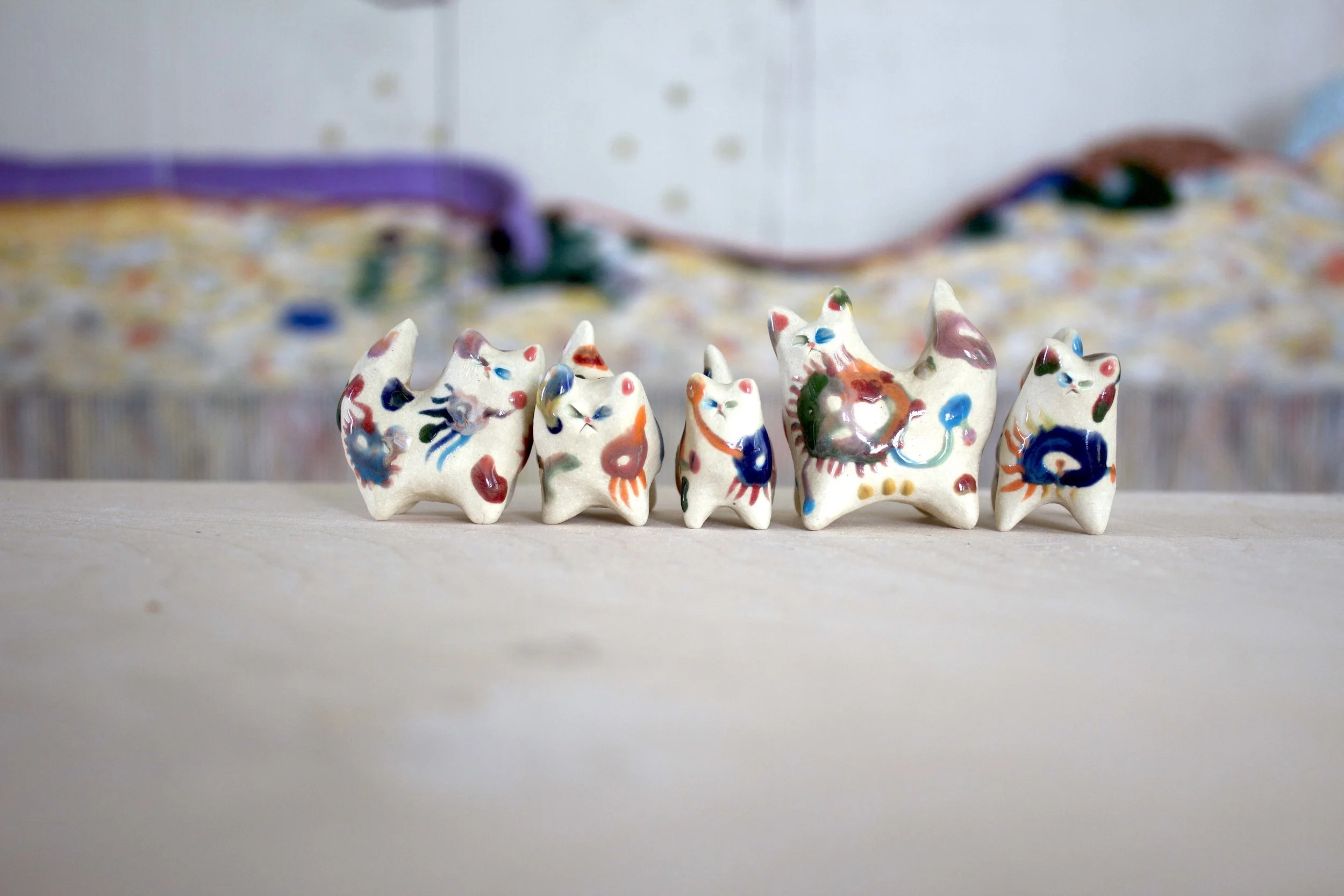 Group of Cell Life cat sculptures showing collection variety.jpeg