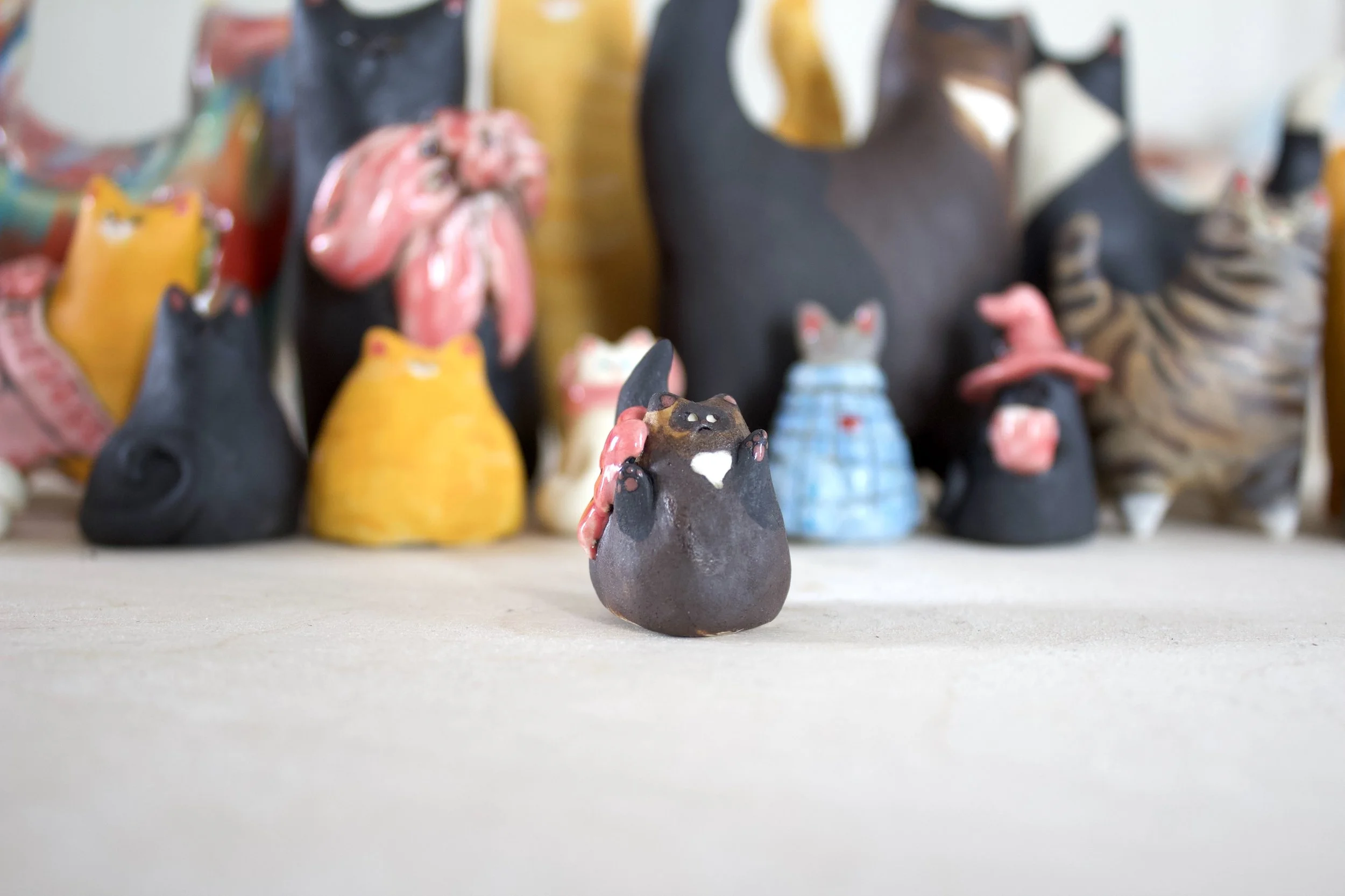 Chocolate Point Siamese handmade ceramic cat chime with pink bow.jpeg