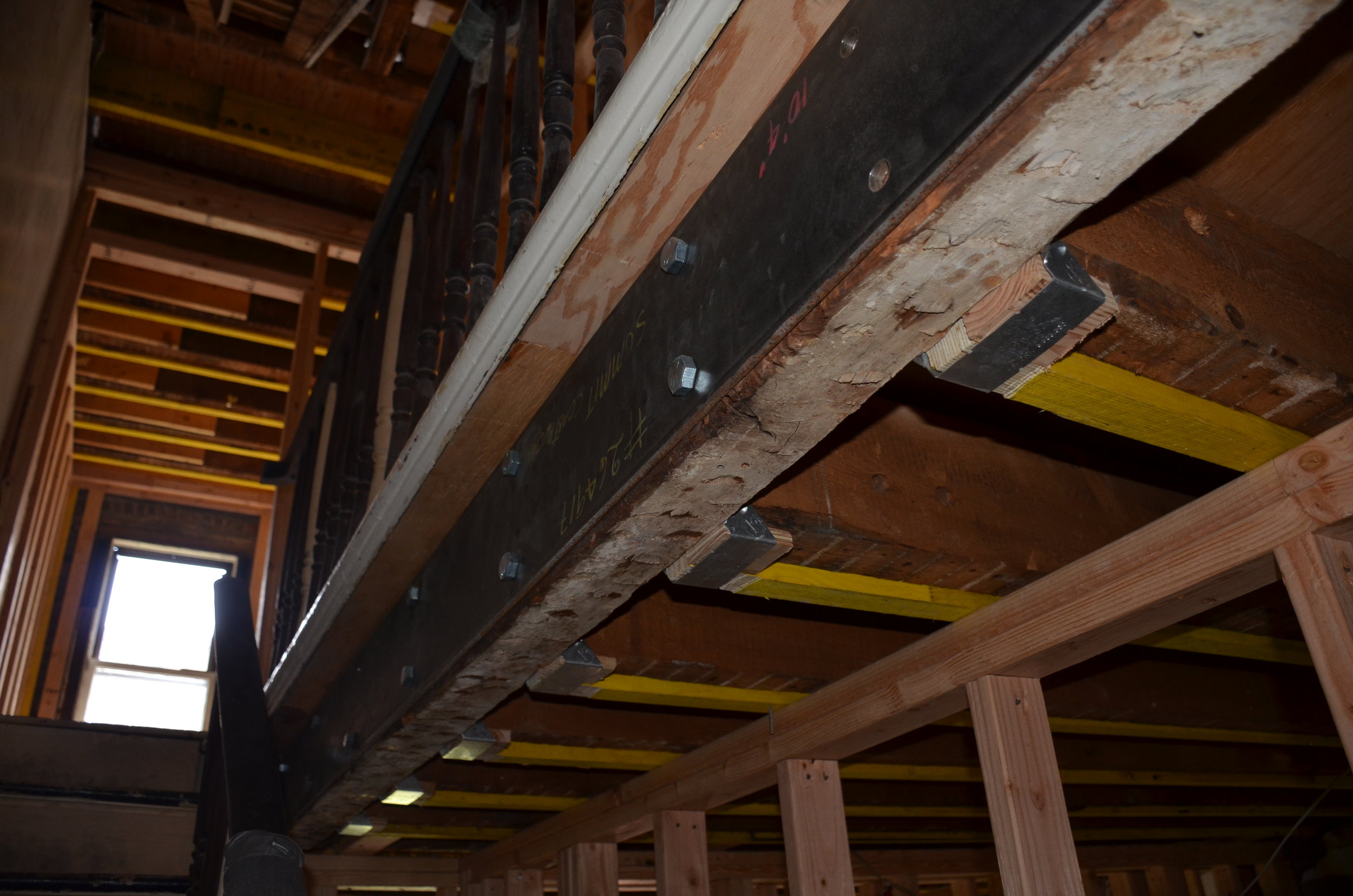 Detail of flitch plate steel girder system reinforcement at stairwell