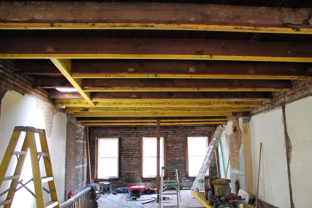 Roof joist sistered and skylight opening over stairwell partially framed in