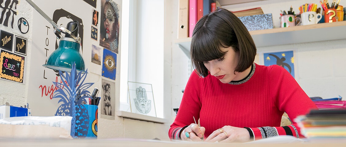 Poppy papercutting in studio