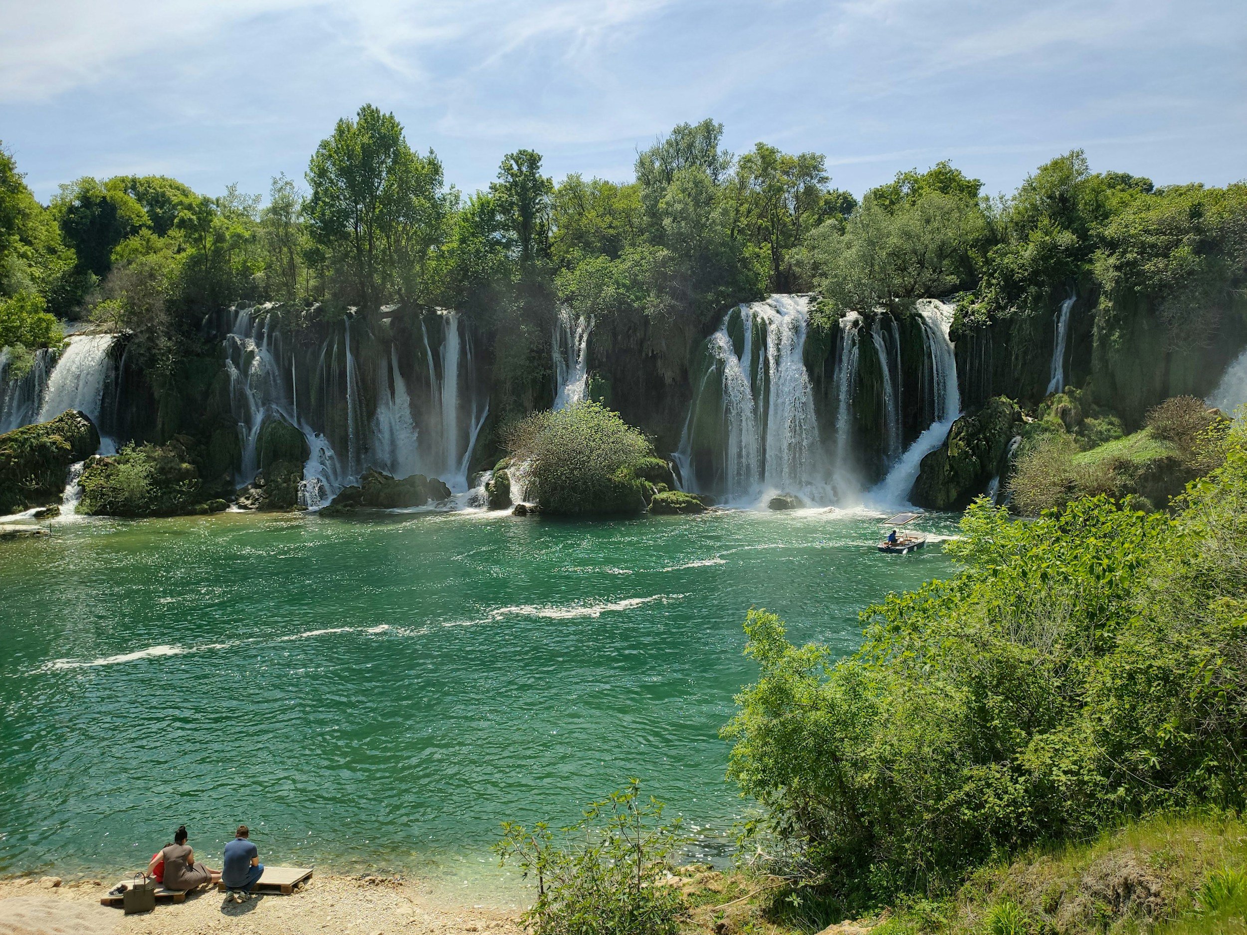 Kravice waterfalls with boat