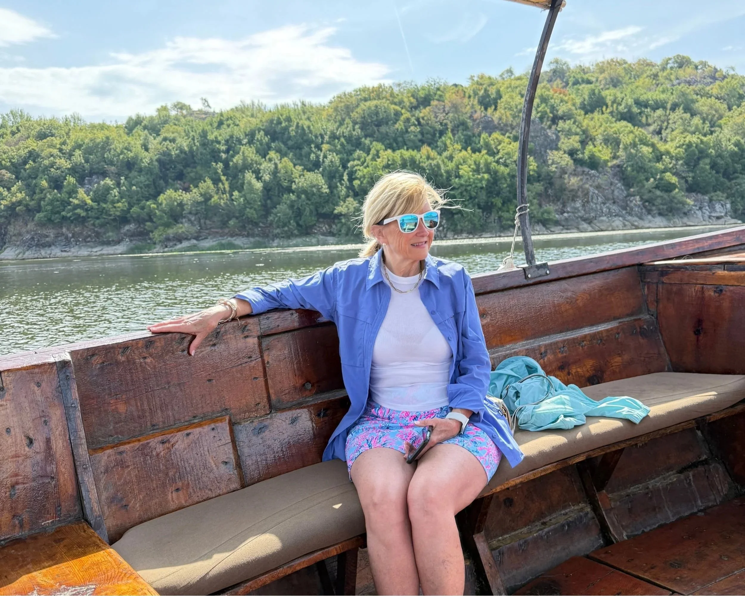 Small boat cruising across Skadar Lake in Montenegro.
