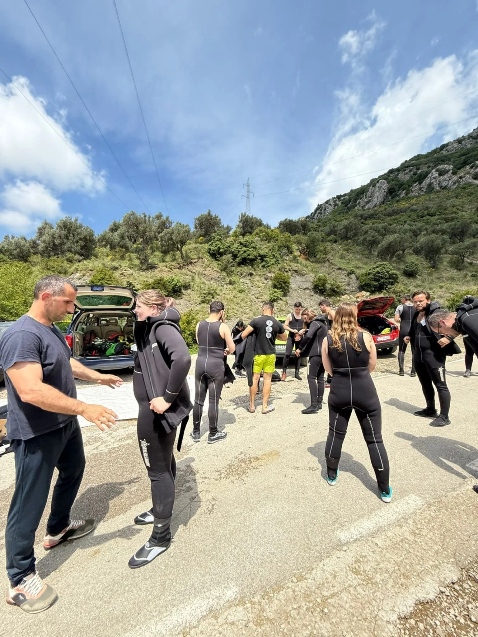 dressing neoprene suits before canyoning in rikavac