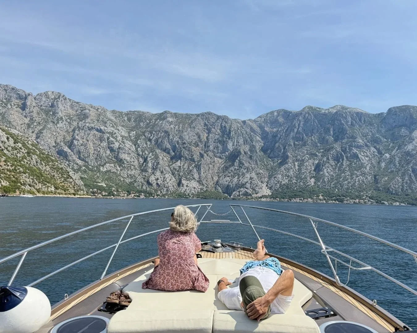 Couple looking at the calm Adriatic Sea from a scenic viewpoint