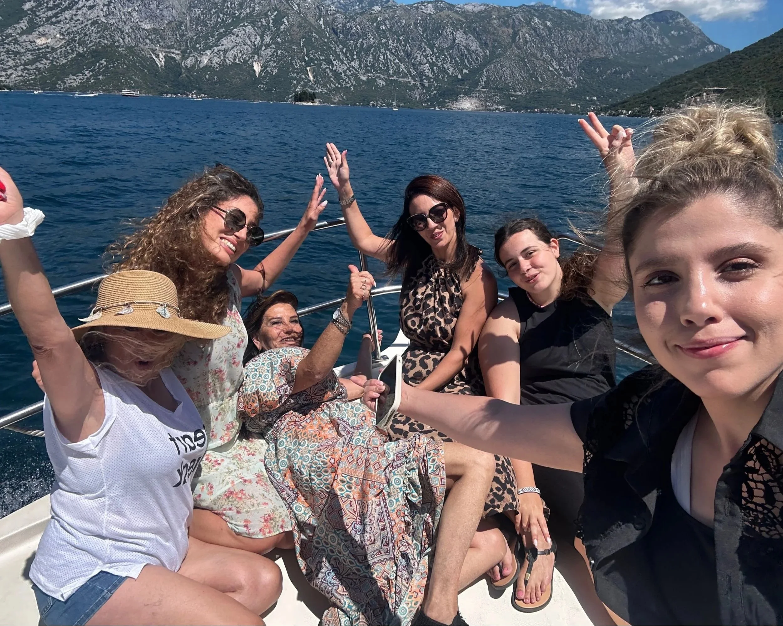 Guests enjoying a boat ride on the Adriatic Sea along the Montenegrin coast.