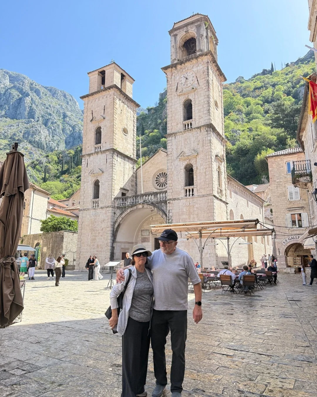 Couple walking through Kotor Old Town in Montenegro