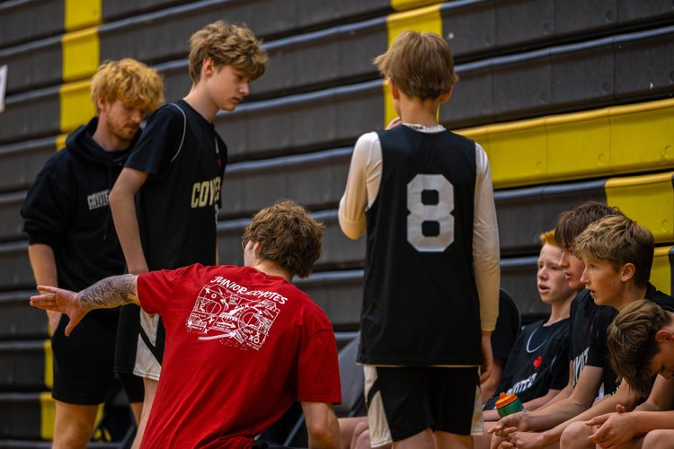 Coach Austin Swedish demonstrating a drill with Junior Coyotes players