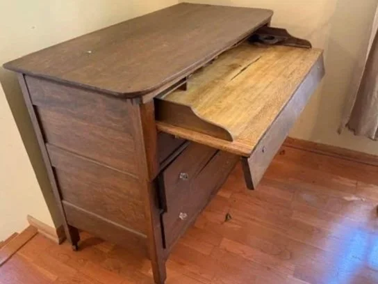 Combination clothes drawer and vintage writing desk (slides out). Hard to gauge age, take to Antiques Road Show to verify.