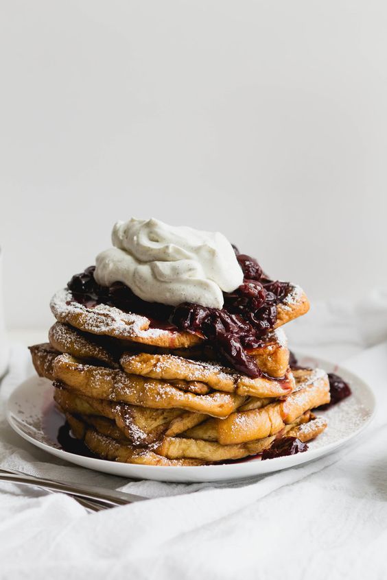 French toast with whip cream and blueberries