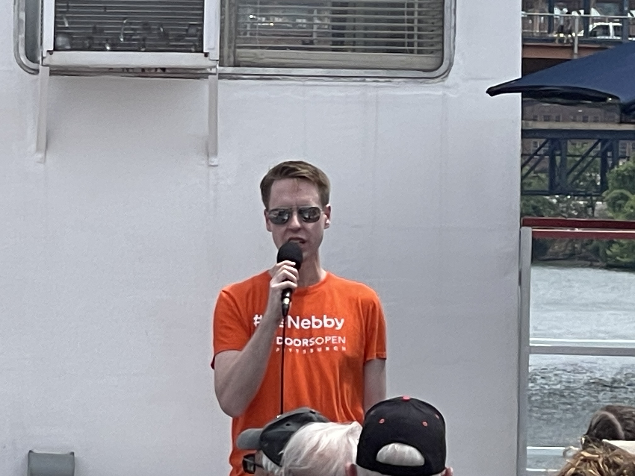  Todd Wilson speaks to crowd at boat tour. 