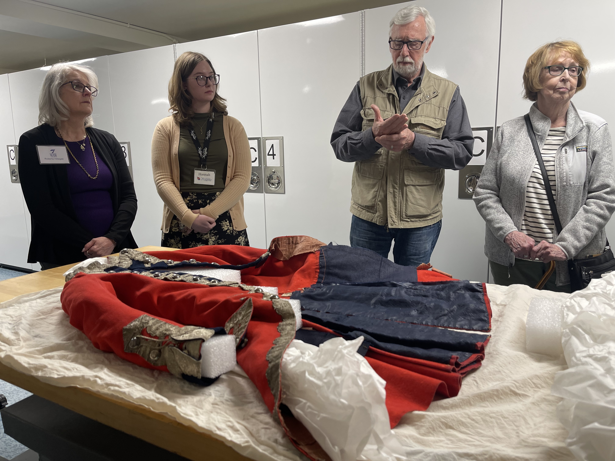 Attendees observe coat