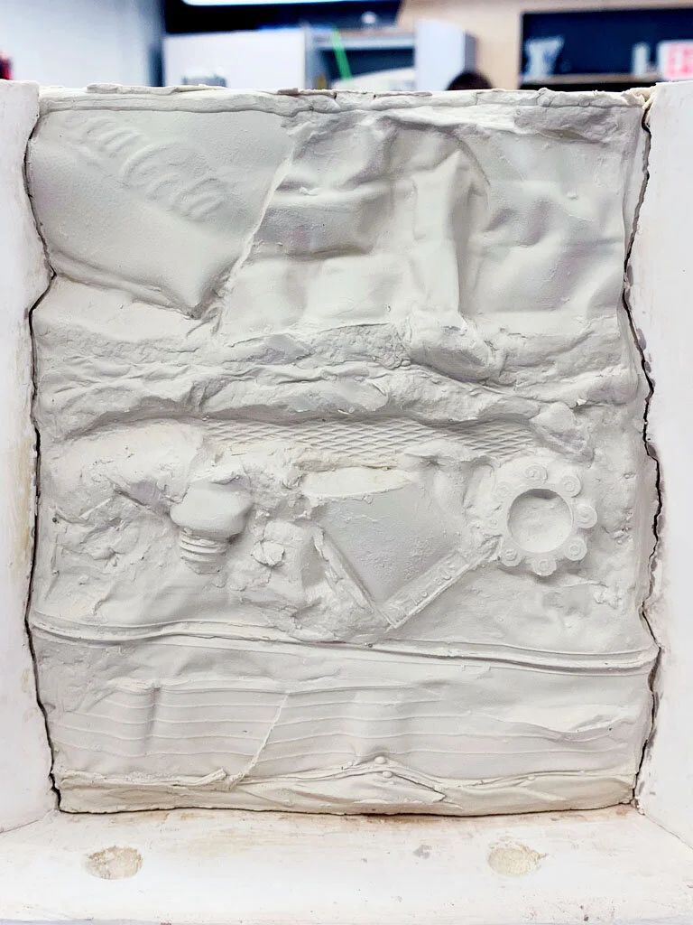 Porcelain wall with recognizable plastic debris and common pollutants