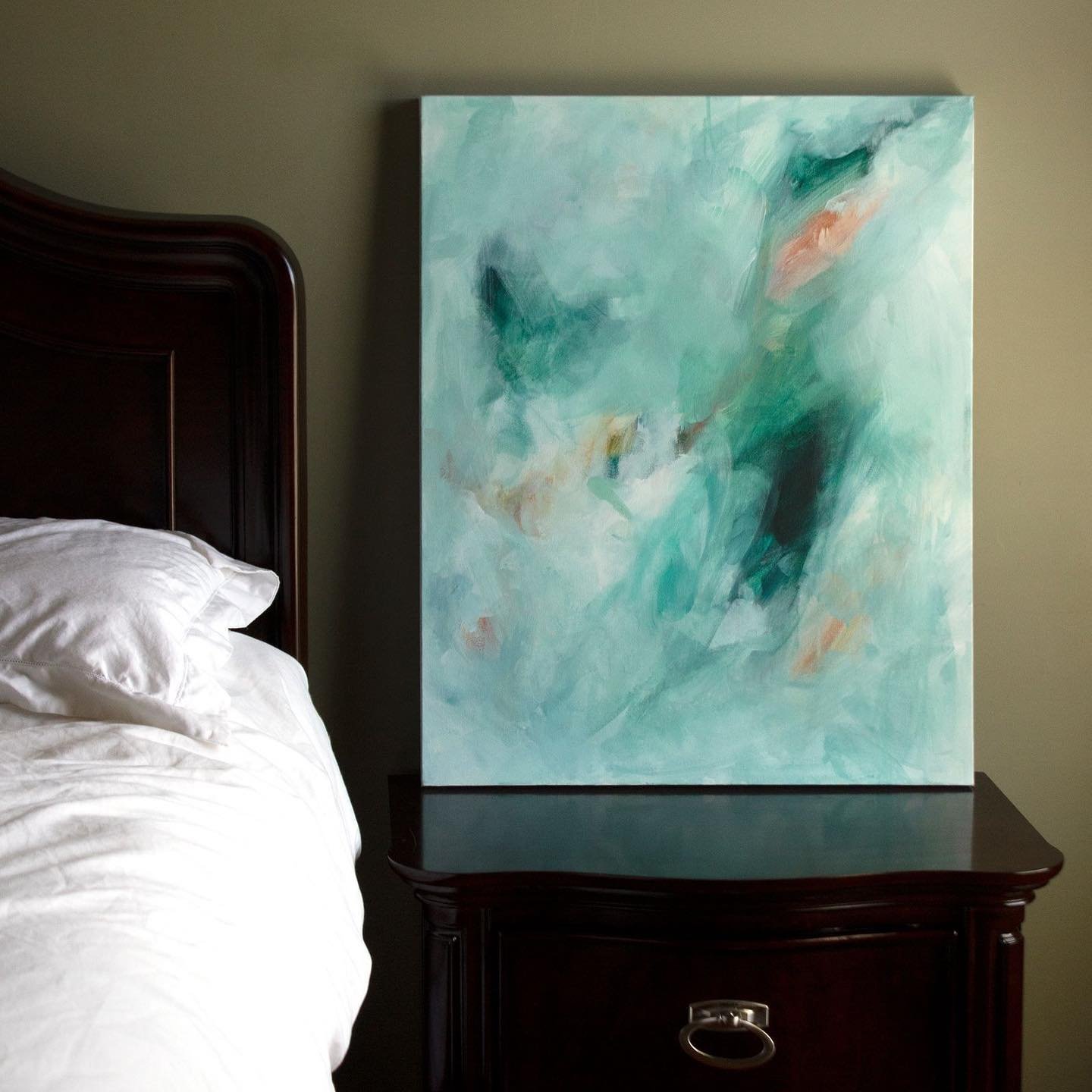 Teal glacier blue abstract painting styled in a bedroom.jpg