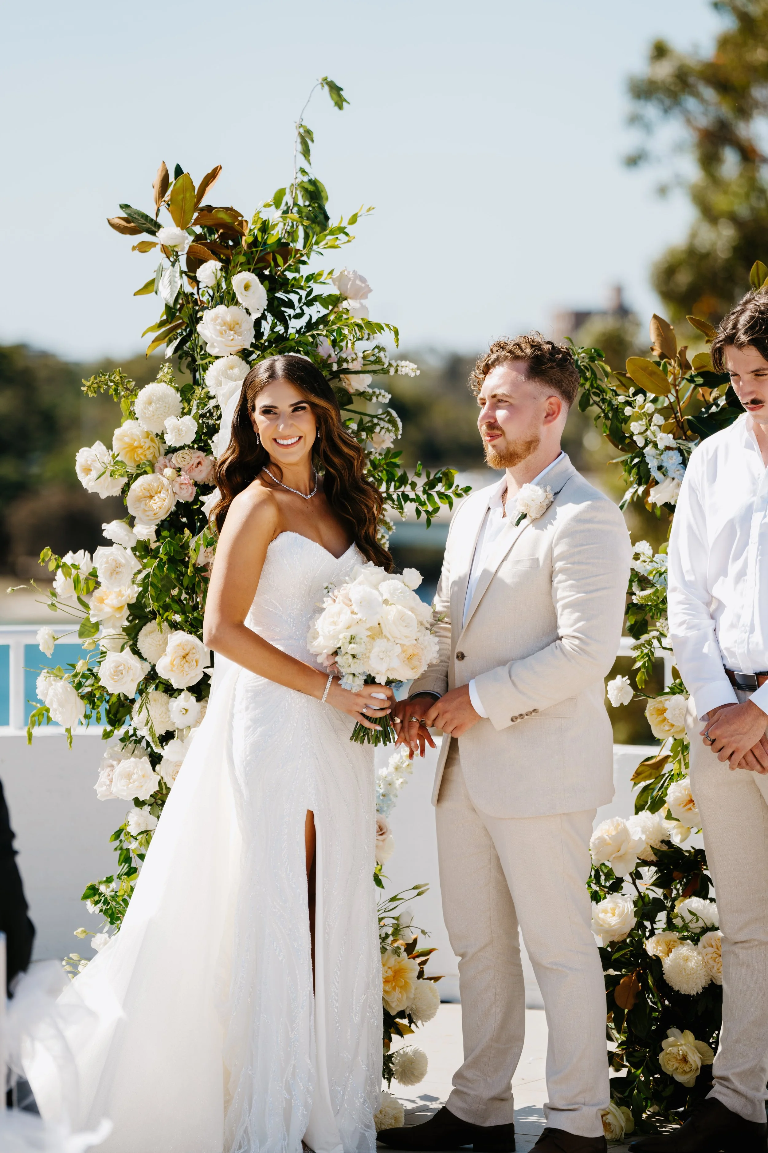 Monica and Hunter with white wedding flowers at Tradewinds in Fremantle