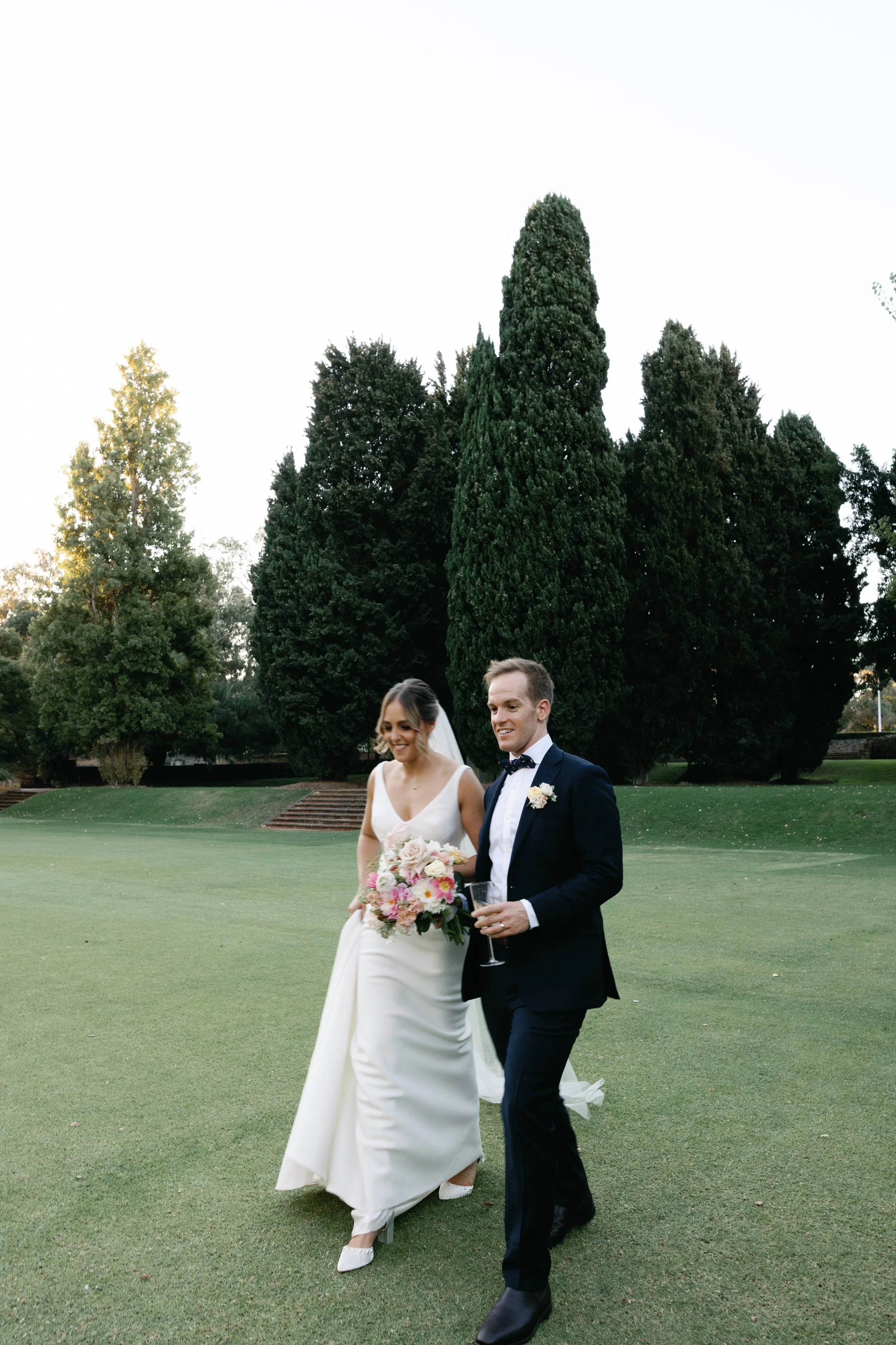 Bride and groom with a romantic pastel wedding bouquet at UWAPerth
