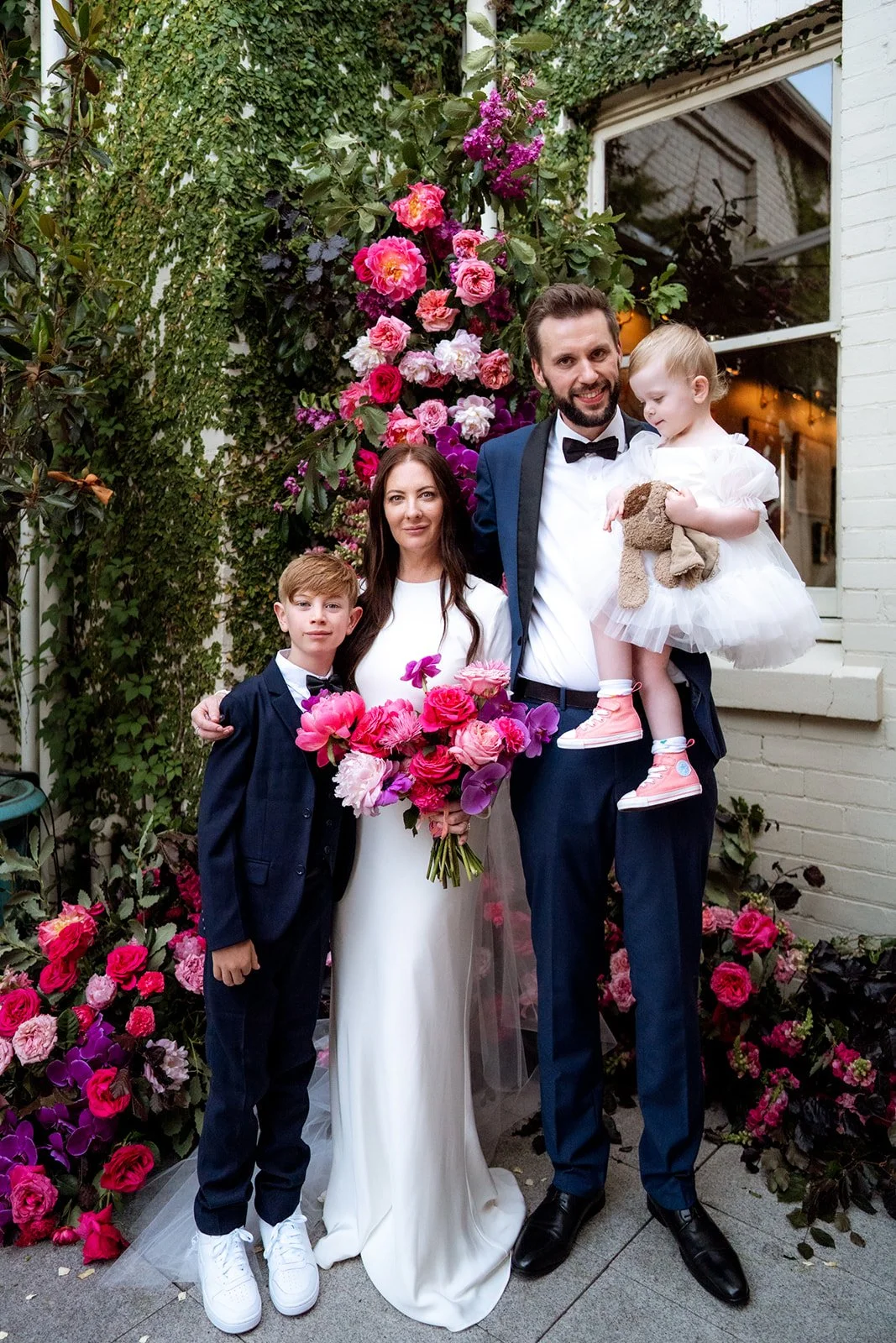 Bride and family with vibrant pink wedding flowers at Guildhall Event Space in North Fremantle