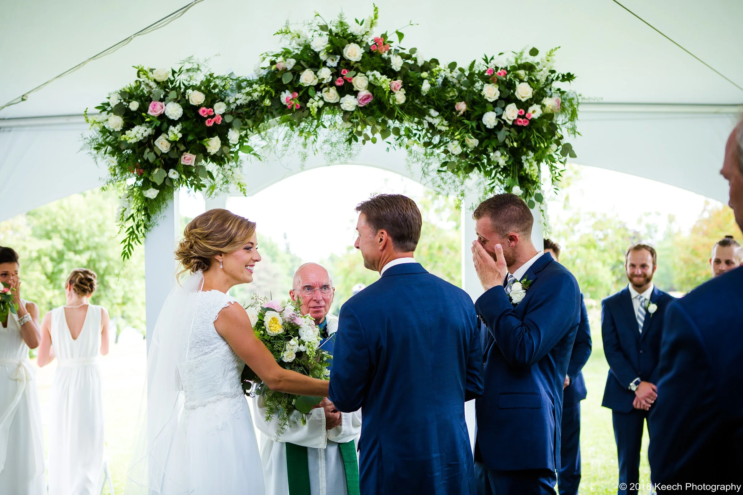 Wedding ceremony on the waterfront of Colloca Estate Winery