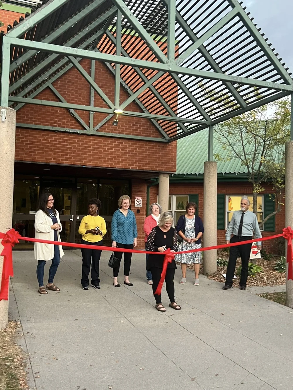 Ribbon cutting at the entrance of 410 Sunset Drive when King's Academy opened its new home