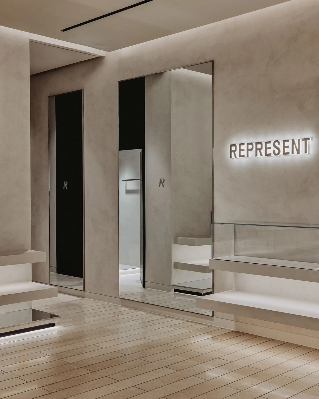 Completed microcement interior at Represent Manchester, combining seamless finishes with the store's contemporary retail design.