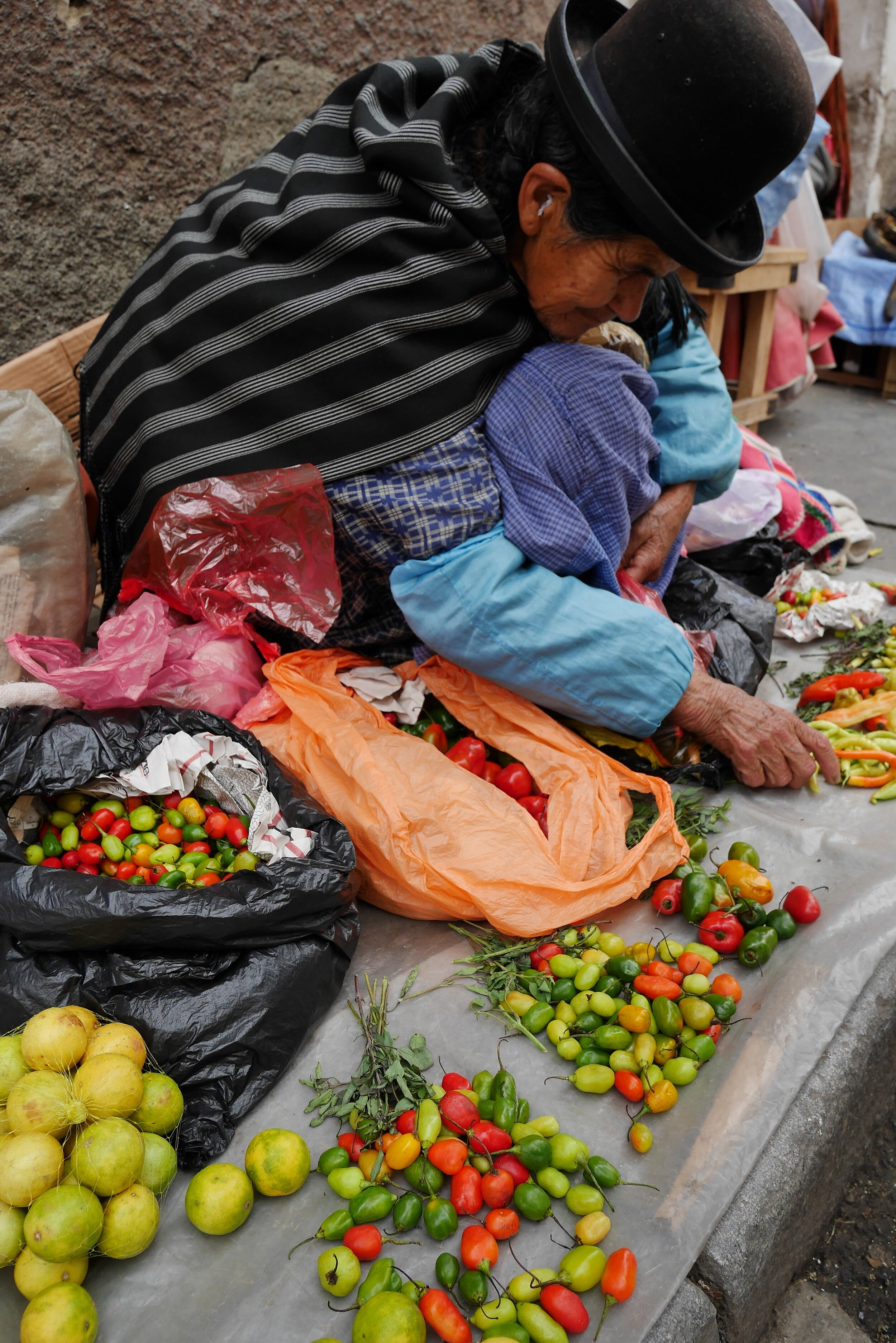 A lady selling chillies in Peru