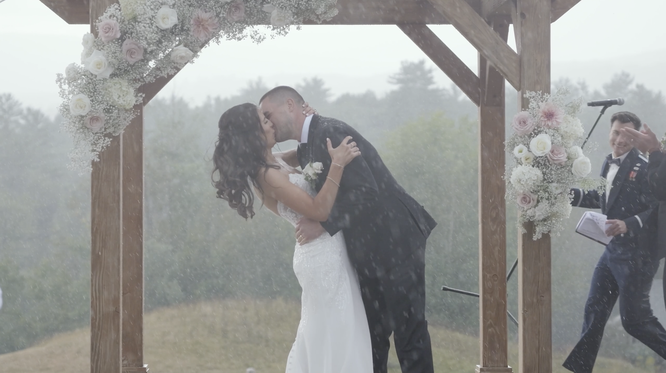 A Bride and Groom in the rain at Owl's Nest Resort in New Hampshire