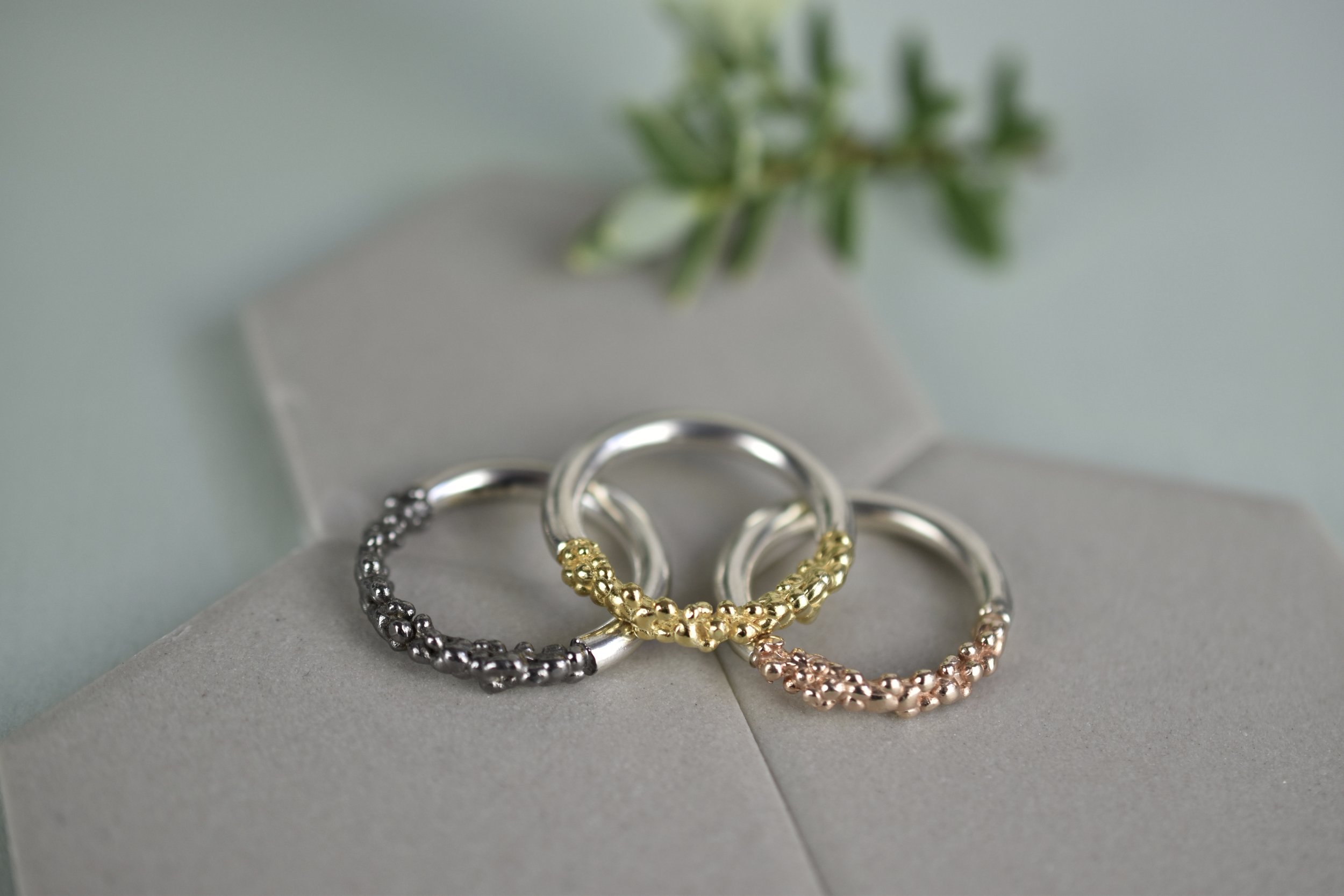 Trio of stacking bubble texture sterling silver rose gold black gold rings Militza Ortiz