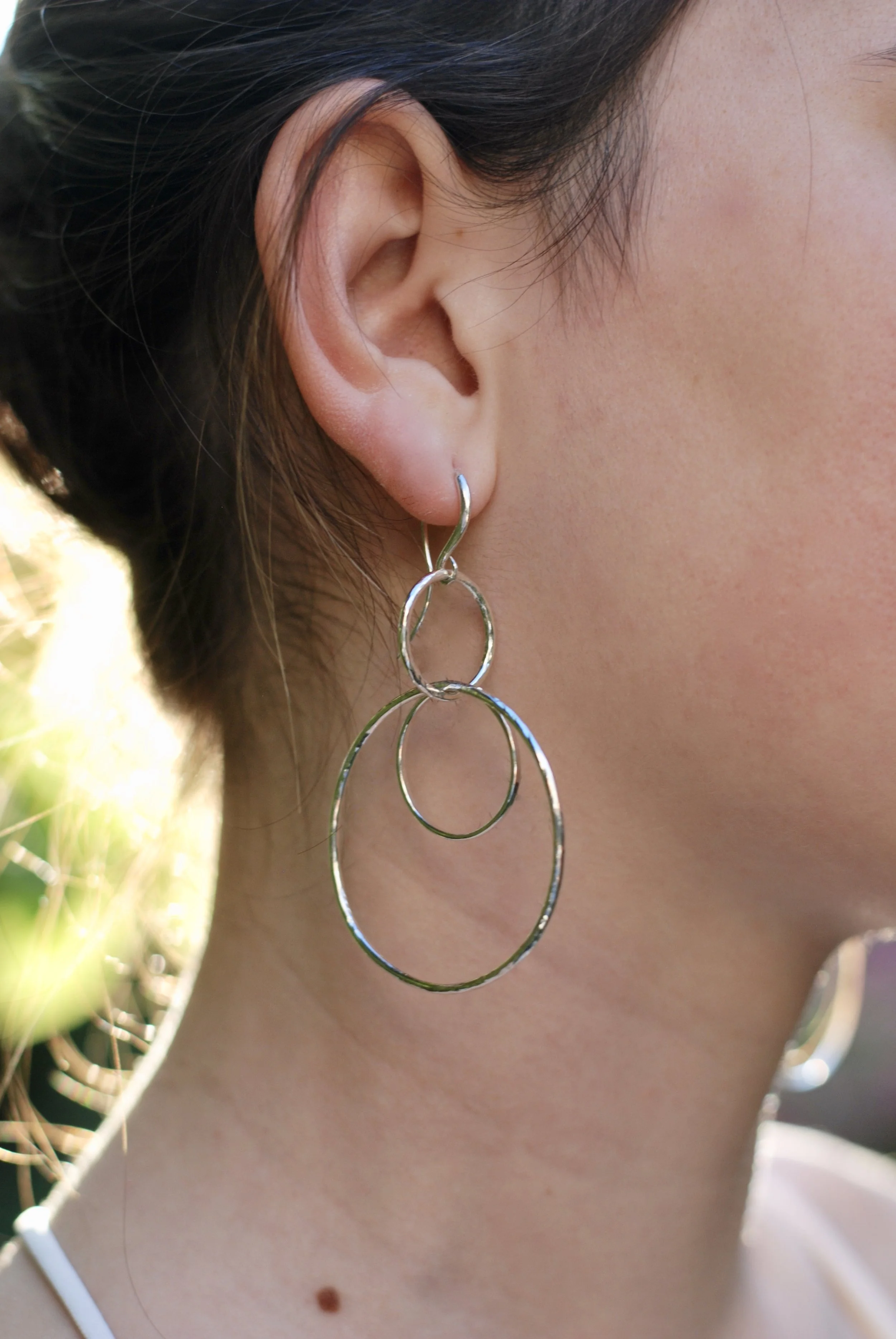 Earrings in hammered sterling silver circles by Militza Ortiz