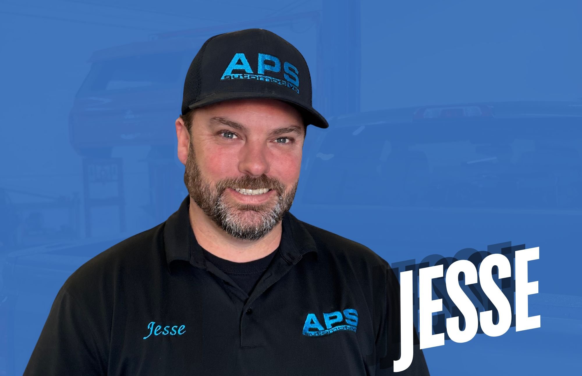 A man wearing a black cap and polo shirt with blue embroidery. The cap and shirt have the "APS" logo. The background is blue with the name "Jesse" in light blue and large white text "Jesse" overlayed.