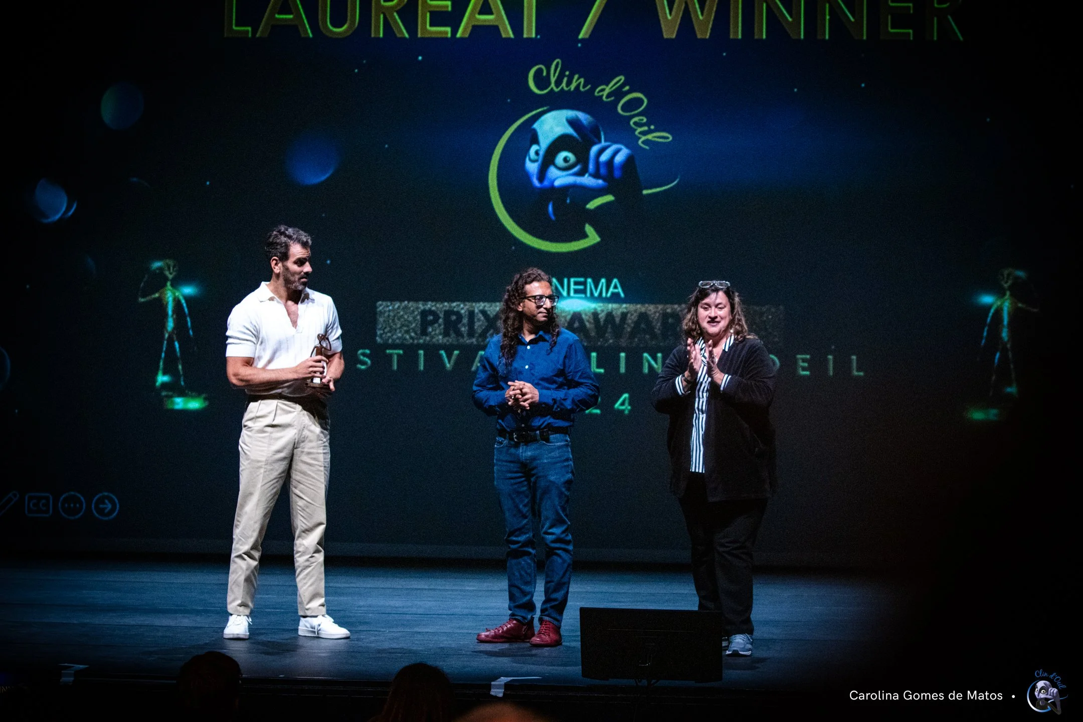 Nyle DiMarco presents the Best Documentary Feature award to BEING MICHELLE director Atin Mehra at the Clin d’Oeil Festival in France, with team member Lisa Gonzales onstage.