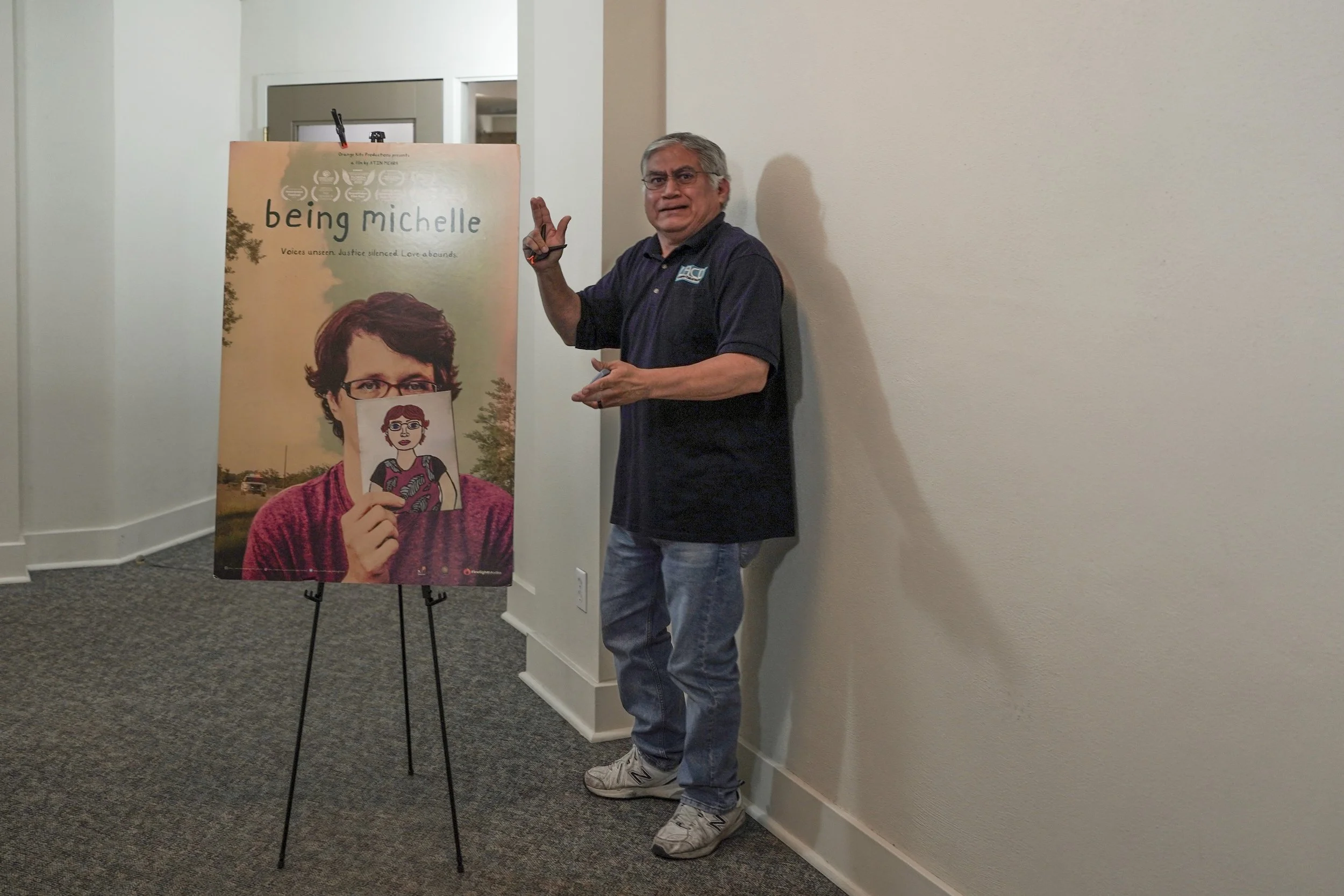 A Being Michelle documentary poster is displayed at a community screening event, marking the space where audiences gathered to engage with the film.