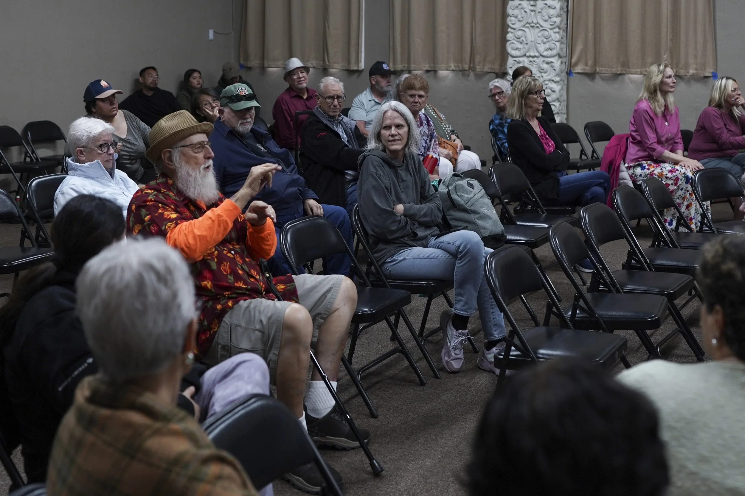 Audience members engage in conversation and listening during a community screening of Being Michelle.