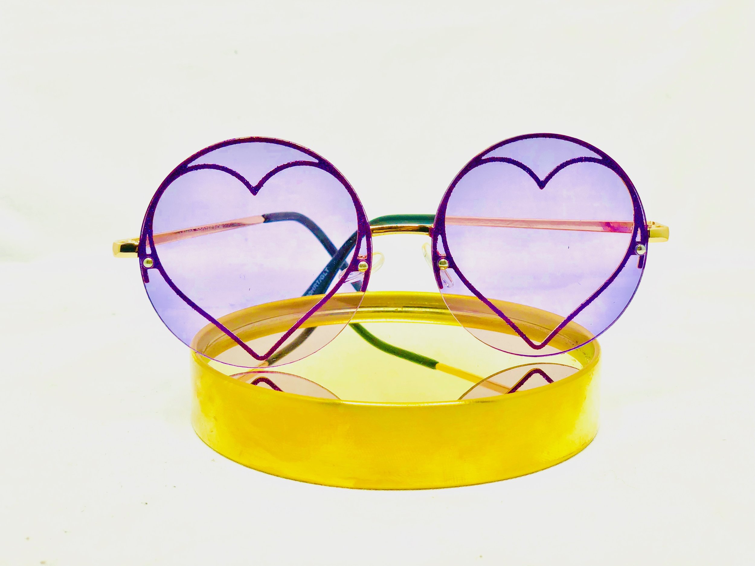 Purple round frames filled with glitter heart