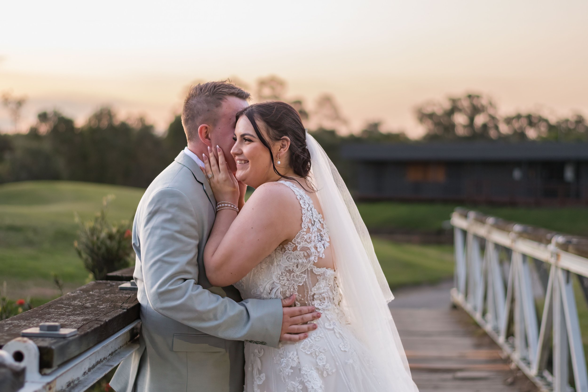 A bride and groom sharing a tender moment at sunset during their Parkwood wedding on the Gold Coast, photographed by Scott Hardy