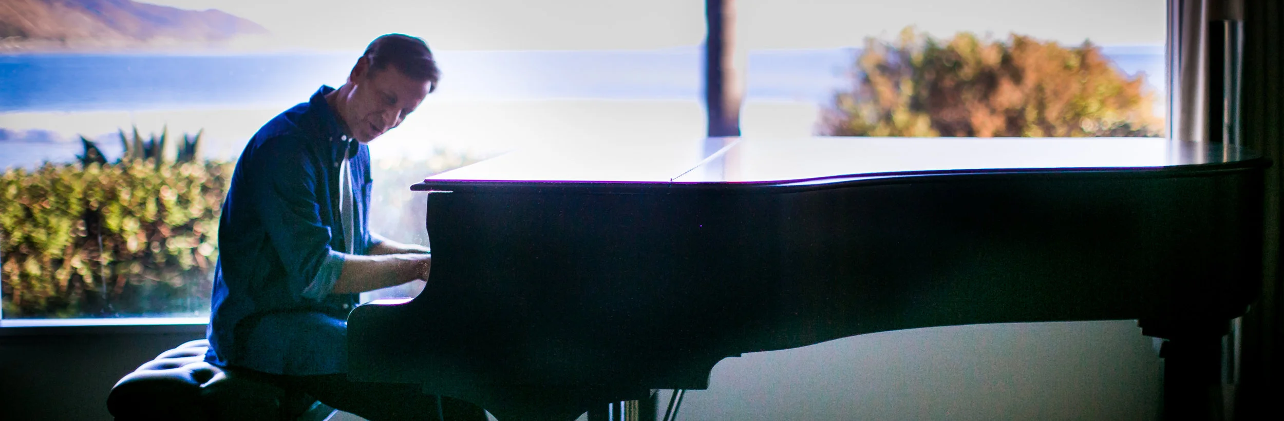 pete bio with piano.jpg