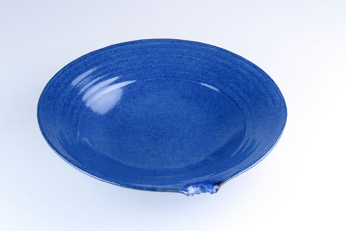 Blue dish with a bite