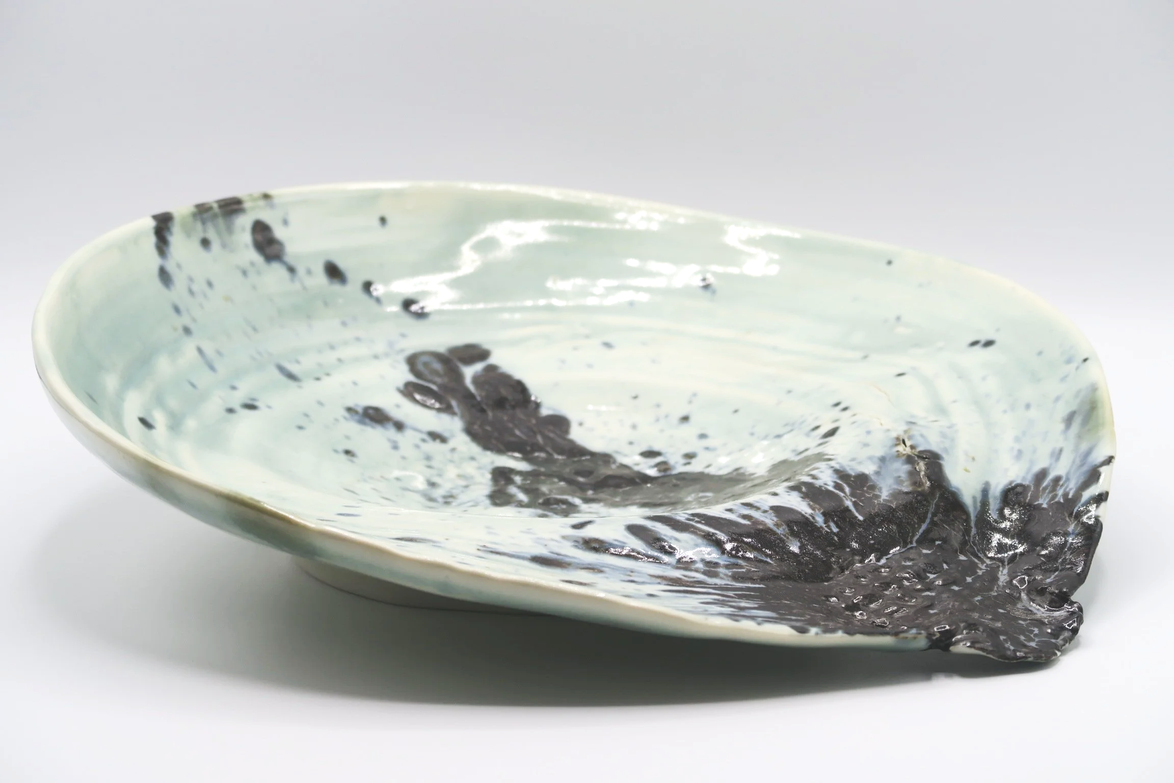 A large thrown and altered stoneware vessel -