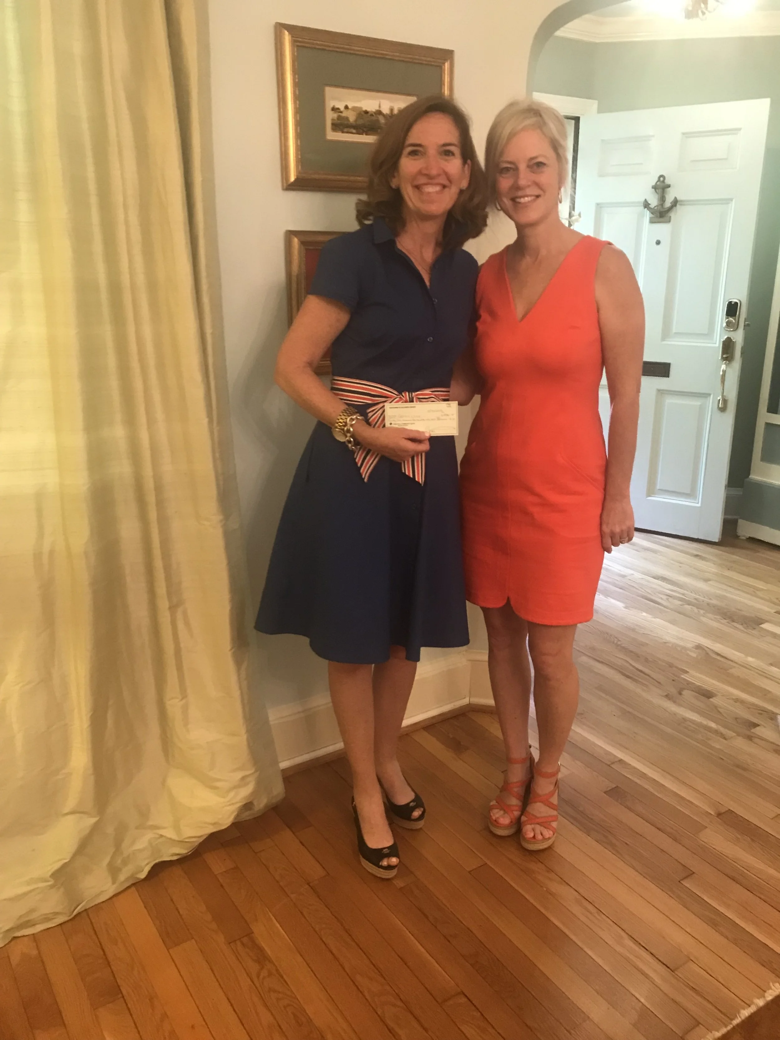 (L to R) Terry O’Hara Lavoie (Culmore Clinic) and Rebecca Burton (NVAL's Silent Auction Chair) at the NVAL’s fundraising luncheon. The Auction set a record as the largest auction held by the group.