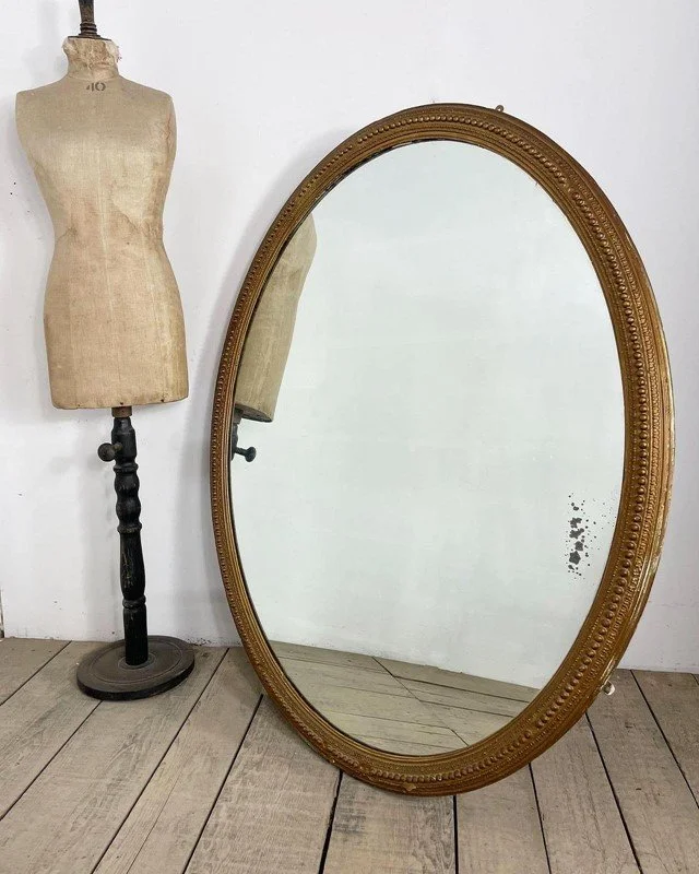 Large Victorian antique oval foxed mirror