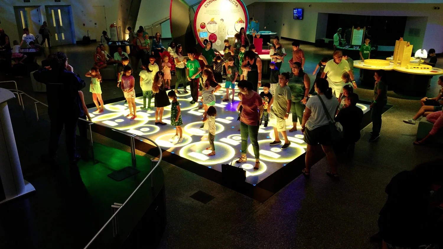 Kids and adults playing a calorie burning game on the ActiveFloor.