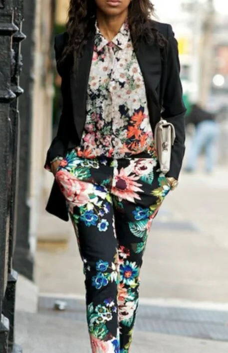 Use two completely different patterns, and bring in a third that ties in elements of the first two. The black blazer picks up the black in both prints and ties everything together.