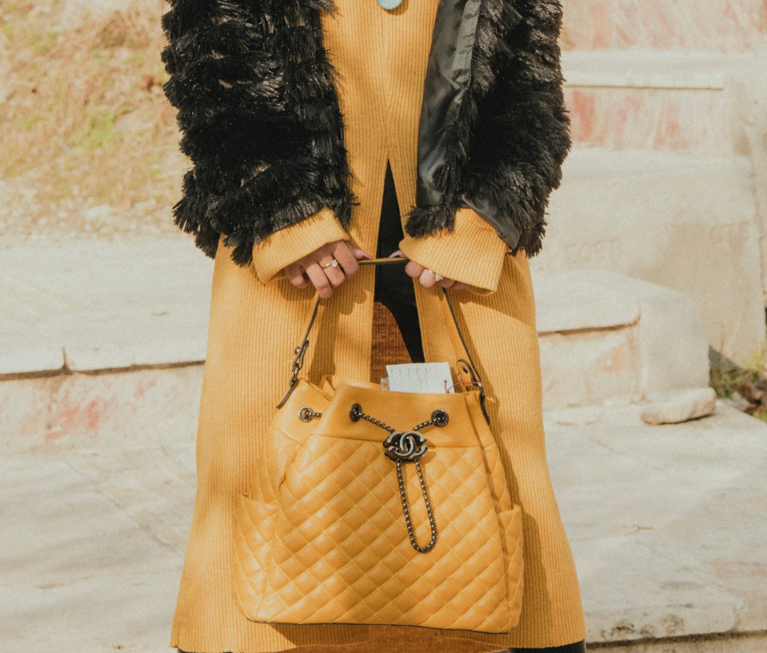 Add a pop of color with a statement bag.