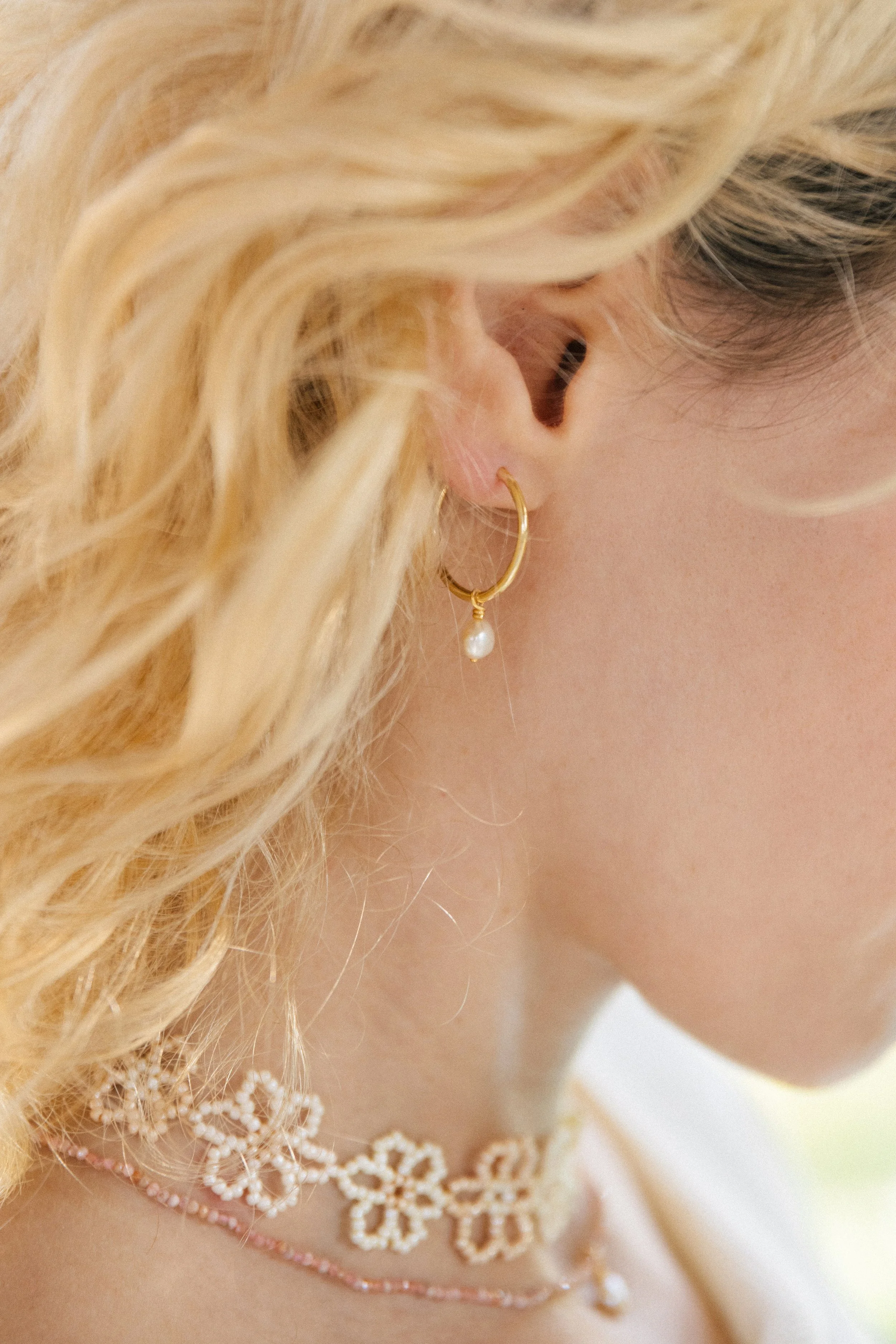 sun-and-her-beaded-bali-flower-necklace-nude-apricot-closeup.jpg