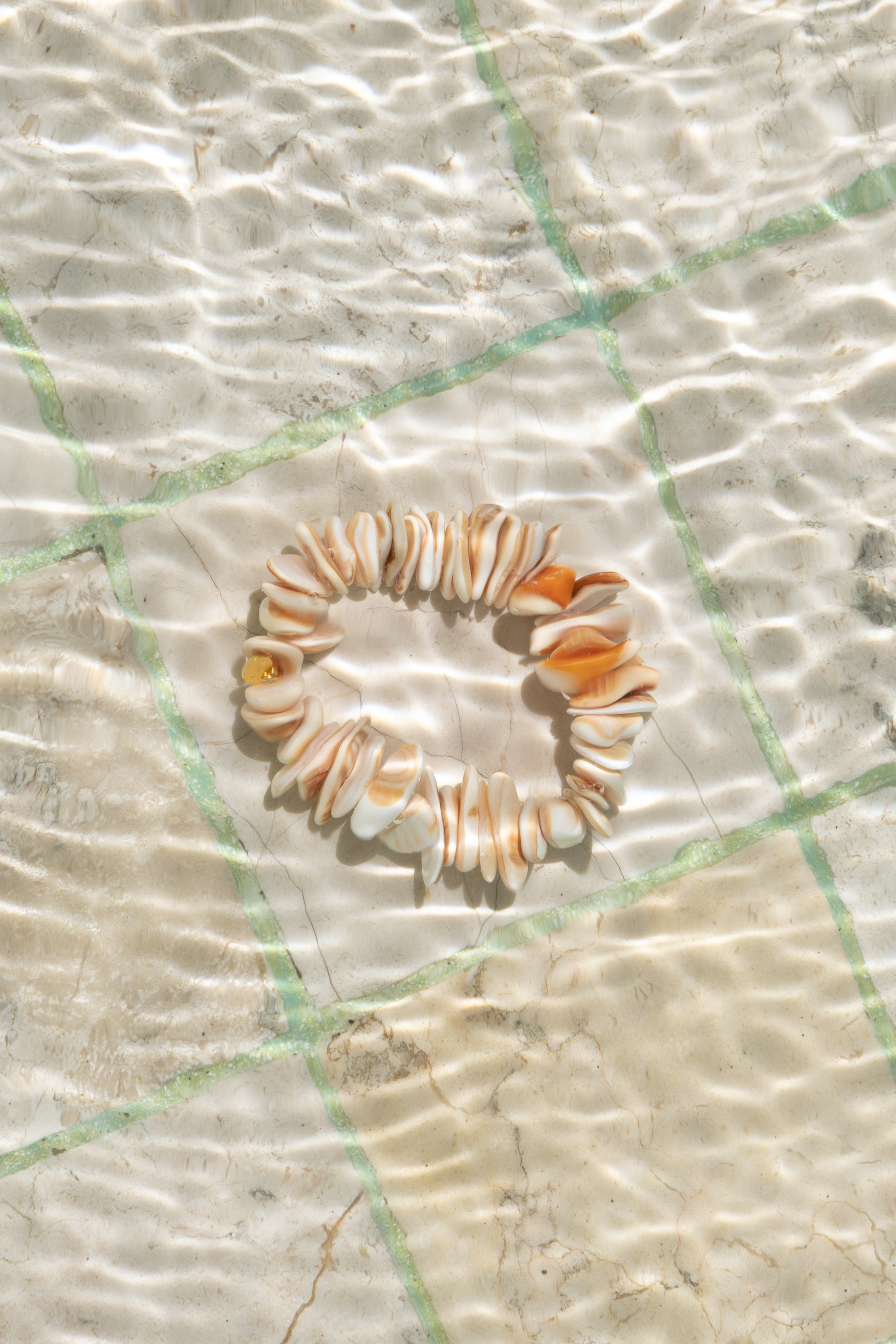 sun-and-her-peach-shell-bracelet-water.jpg