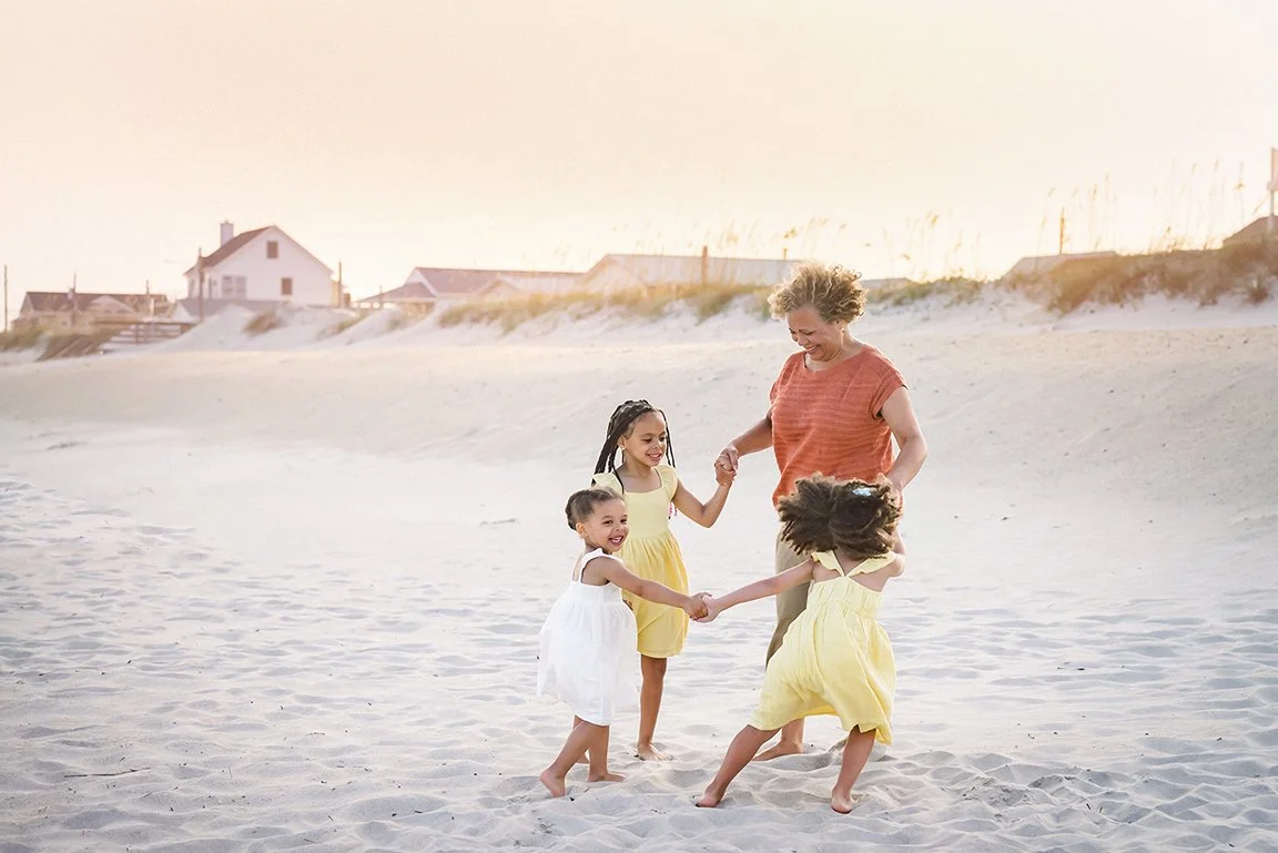 Grandmother with granddaughters on the beach WEB.jpg