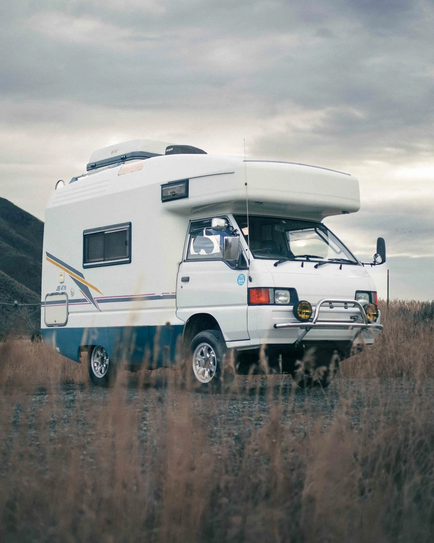 🚨New Van For Sale🚨👇

Meet Sully &mdash; a 1996 Delica JB470 camper van with big blue energy and all the charm of its namesake. Two-tone white and blue paint, a bull bar up front, fog lights, roof storage box, and a rear utility ladder give it that