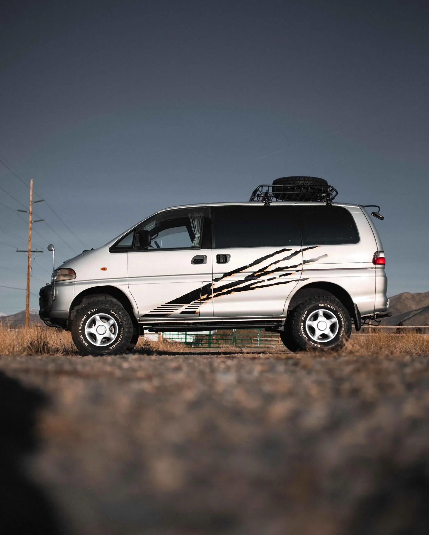 Sidewinder was reserved before we could even list it! We stacked this thing with a bunch of mods before it left the shop:

- Custom Nomadic Claw Graphic
- 2-inch lift
- 31-inch A/T tires
- Economy Tune
- 3-in-1 Gauge Pod

This low roof L400 has a ful